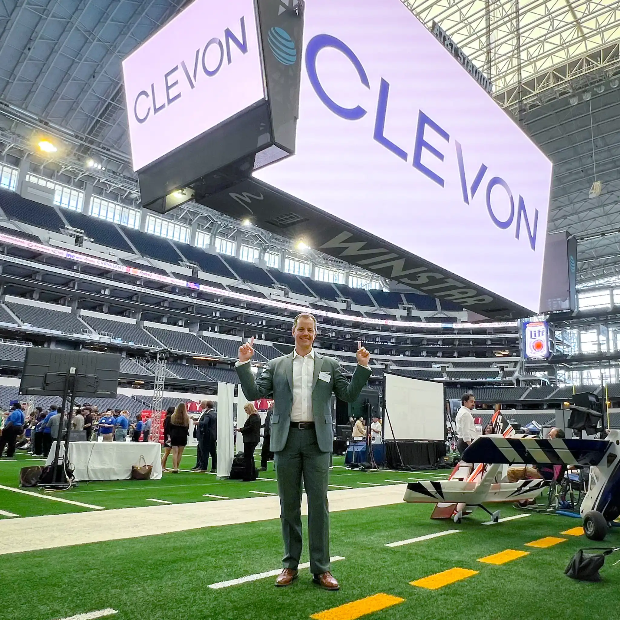 Clevon COO Meelis Anton at the ATT stadium posing with the largest Clevon logo