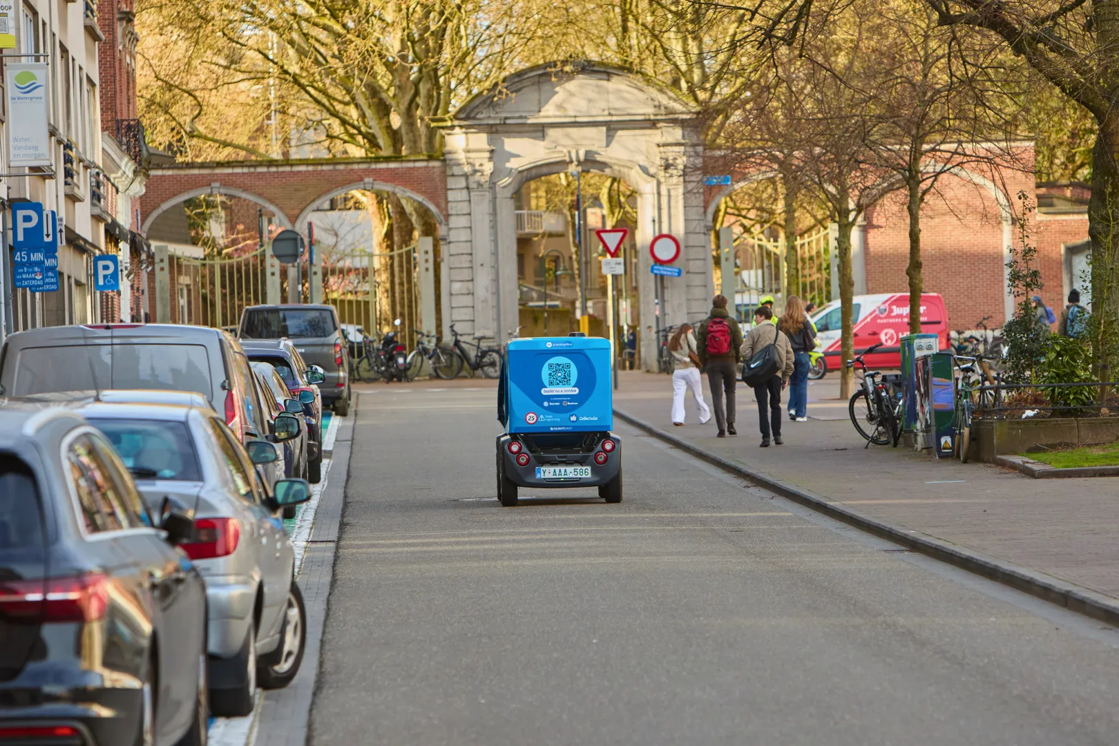 GO Bot unmanned delivery vehicle operating in live traffic among cars and cyclists in Leuven Belgium